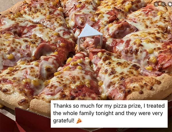 Image of pizza with overlaid text from winner thanking us!