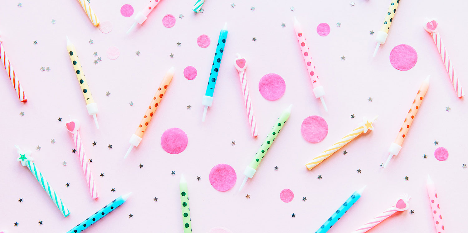 Birthday candles on pink background